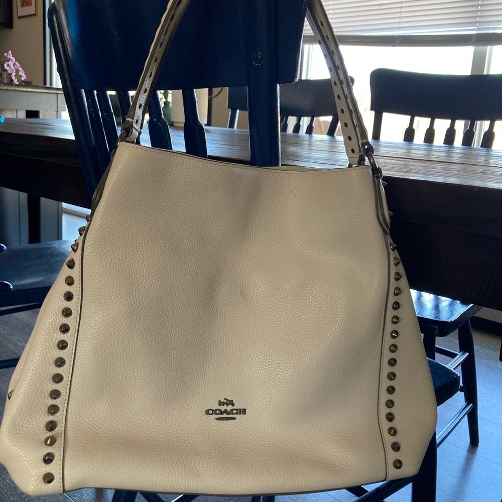 Coach handbag with spikes.